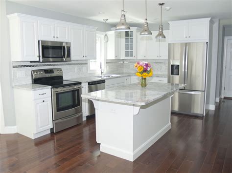 galley kitchen white cabinet stainless steel appliances light marble countertop|modern white galley kitchen.